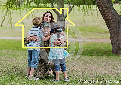 Family hugging each other in the park against house outline in background Stock Photo