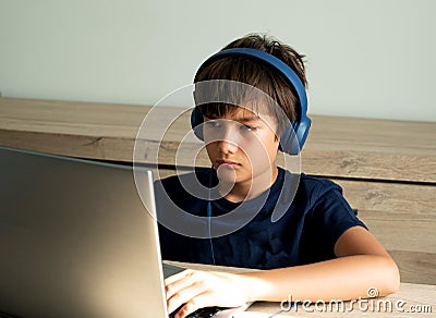 Family issue, Teen boy wearing headset have bad habit problem addicted to online game on Computer. Teenage boy playing online game Stock Photo