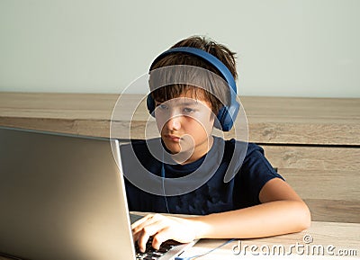 Family issue, Teen boy wearing headset have bad habit problem addicted to online game on Computer. Teenage boy playing online game Stock Photo