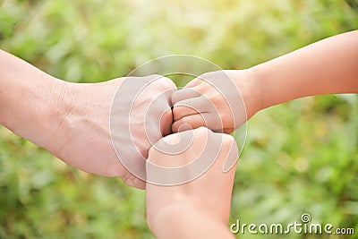 Family join hands together. Stock Photo