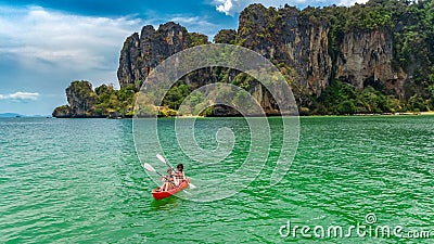 Family kayaking, mother and daughter paddling in kayak on tropical sea canoe tour near islands, having fun, Thailand, Krabi Stock Photo