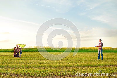 Family launches a kite Stock Photo