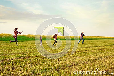 Family launches a kite Stock Photo