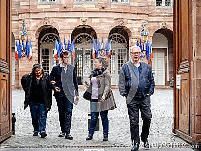 Family leaving polling place French city flags Editorial Stock Photo