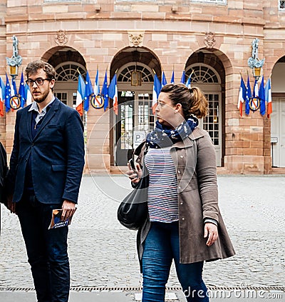 Family leaving polling place French city flags Editorial Stock Photo