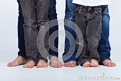 Family legs in jeans portrait Stock Photo