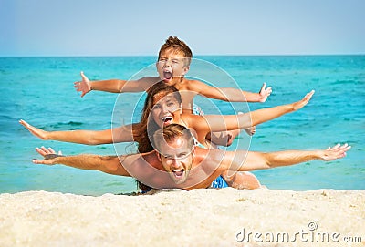 Family with Little Kid at the Beach Stock Photo