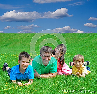 Family in meadow Stock Photo