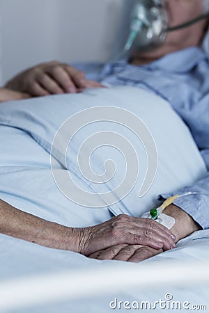 Family member comforting dying patient Stock Photo