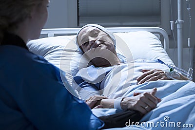 Family member and sick woman Stock Photo