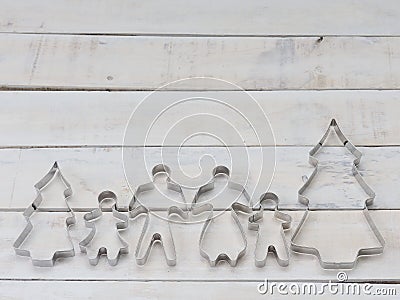 Family metal cookie or biscuit cutter used to cut dough in particular shape composed of father, mother, brother, sister and pine t Stock Photo