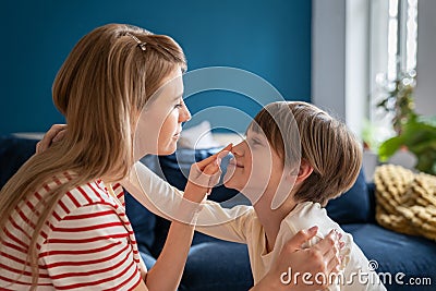 Family, mom and son concept. Parent touching son nose. Kind affectionate empathic caring mother Stock Photo