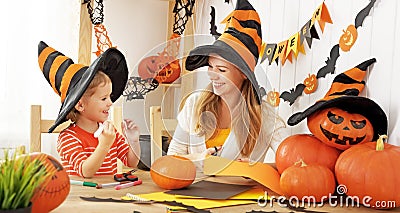 Family mother and child daughter are preparing for Halloween and Stock Photo