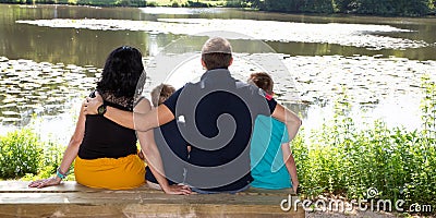 Family mother father and brothers children boys sitting on lake wood bench in web banner template header Editorial Stock Photo