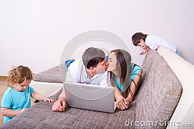 Family of mother, father ,daughter and boy, parent kissing ,kid Stock Photo