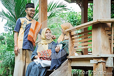 family muslim sitting in the garden and having a conversation Stock Photo