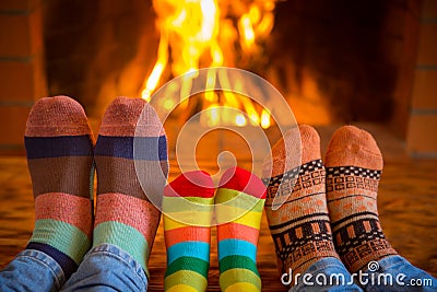 Family near fireplace Stock Photo