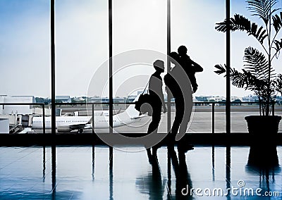 Family in a nice moment at Airport waiting for departure Stock Photo