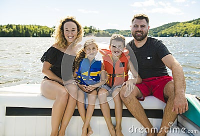 Family out boating together having fun on vacancy Stock Photo