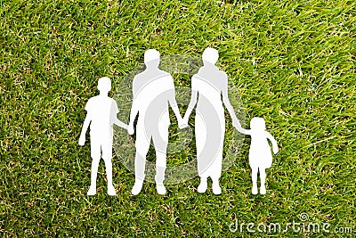 Family Papercut On Grass Stock Photo