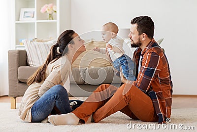 Happy family with baby having fun at home Stock Photo