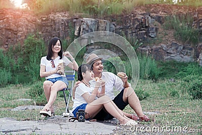 Family picnicking in the midst of nature with the cliff of background Stock Photo