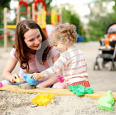 Family on playground Stock Photo