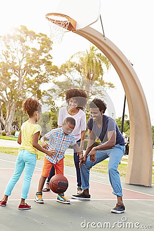 Family Playing Basketball Together Stock Photo