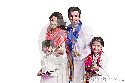 Family playing holi Stock Photo