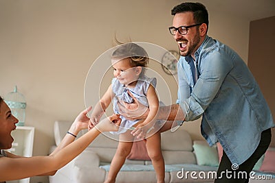 Family playing at home with their little baby. Stock Photo