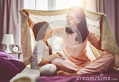 Family playing under blanket Stock Photo