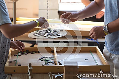 Family plays a board game together quarantined fun Stock Photo