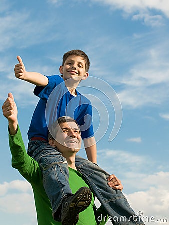 Family pointing thumbs up Stock Photo