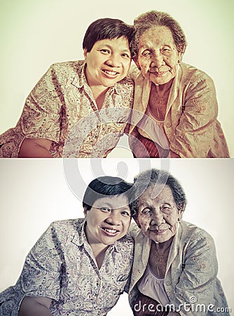 Family Portrait of an Asian elder mother and daughter hugging in Stock Photo