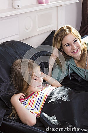Family portrait in bed at home Stock Photo