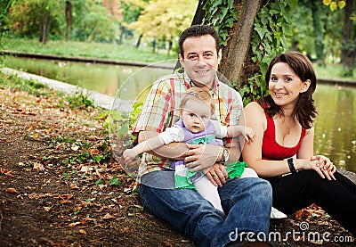 Family portrait - mother father and baby daughter Stock Photo