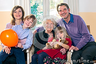 Family posing with grandma. Stock Photo