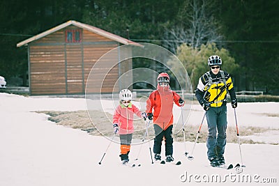 Family practicing cross-country skiing. The volcano Mount Etna, Sicily. Italy. Editorial Stock Photo