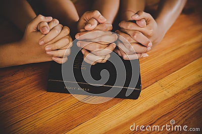 Family pray together praying with parent at home Stock Photo