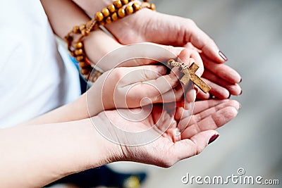 Family prayer with wooden rosary Stock Photo