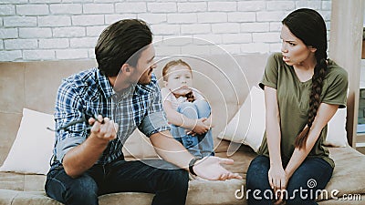 Man Quarrel with Woman with Little Child at Home. Stock Photo