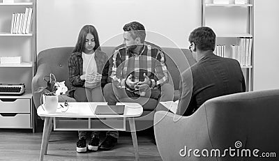 Family psychologist. Social worker counseling parental. Psychotherapy with father and and daughter tenager. Stock Photo