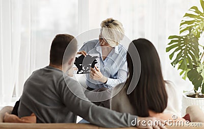 Family Psychologist Working With Couple Showing Inkblot Picture In Office Stock Photo
