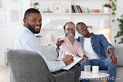 Family Psychotherapy. Happy Black Spouses And Marital Counselor Posing After Successful Therapy Stock Photo