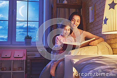 Family reading bedtime. Stock Photo
