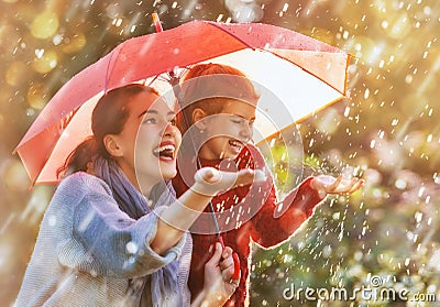 Family with red umbrella Stock Photo