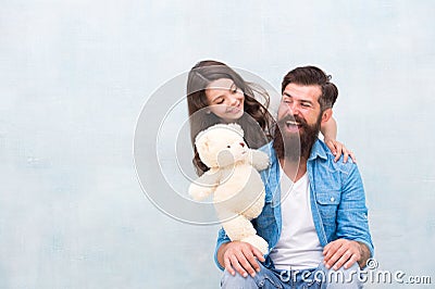 Family relations. Fathers day concept. Giving soft toy teddy bear. Lovely father and kid. Father and daughter light Stock Photo