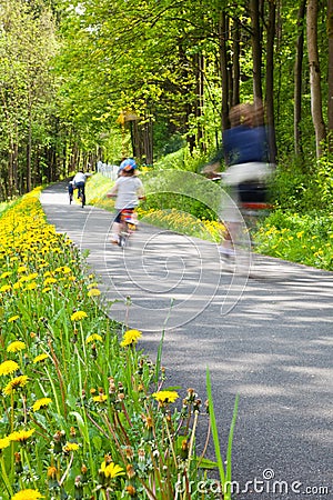 Family riding bicycle at park Stock Photo