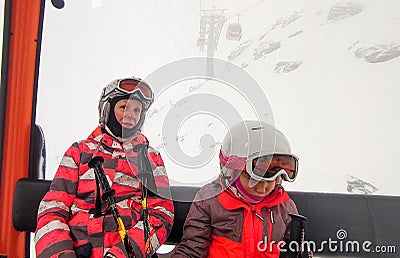 Family riding cabin cable car on winter vacation skiing Stock Photo