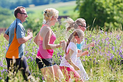 Family running for better fitness in summer Stock Photo